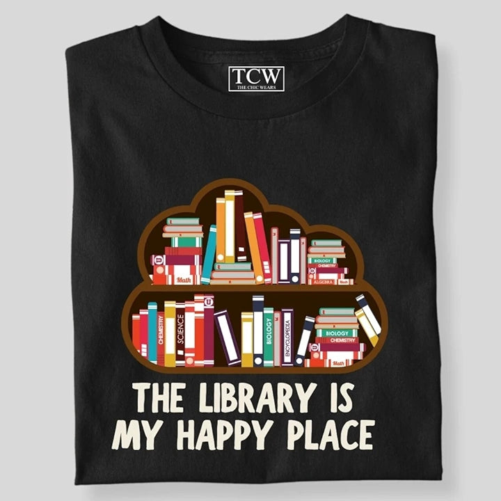THE LIBRARY IS MY HAPPY PLACE SHELF T-SHIRT